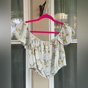 Large, floral, off the shoulder crop top.